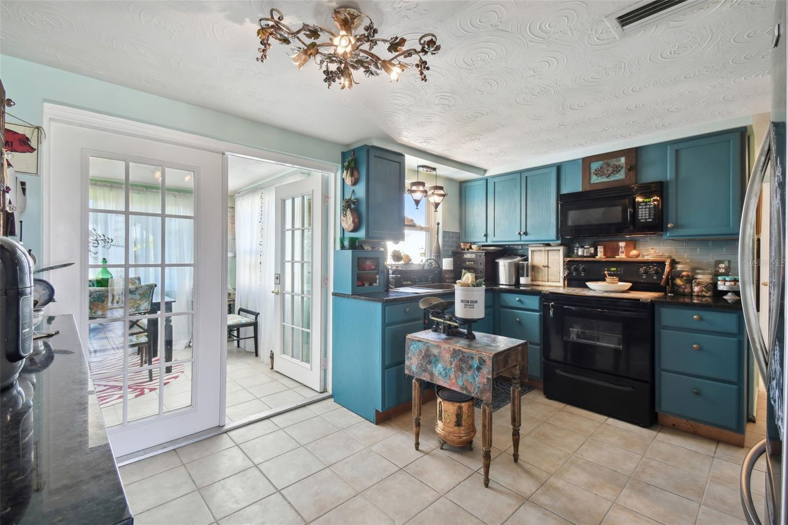 Boho cottage kitchen with copper sink