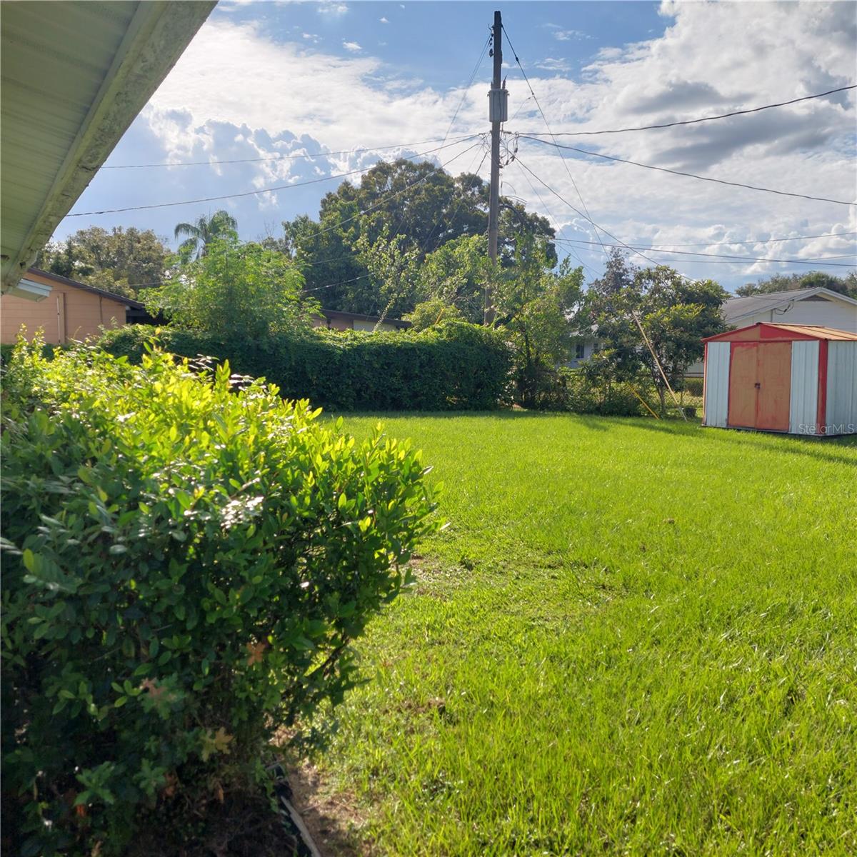 spacious rear yard with metal shed