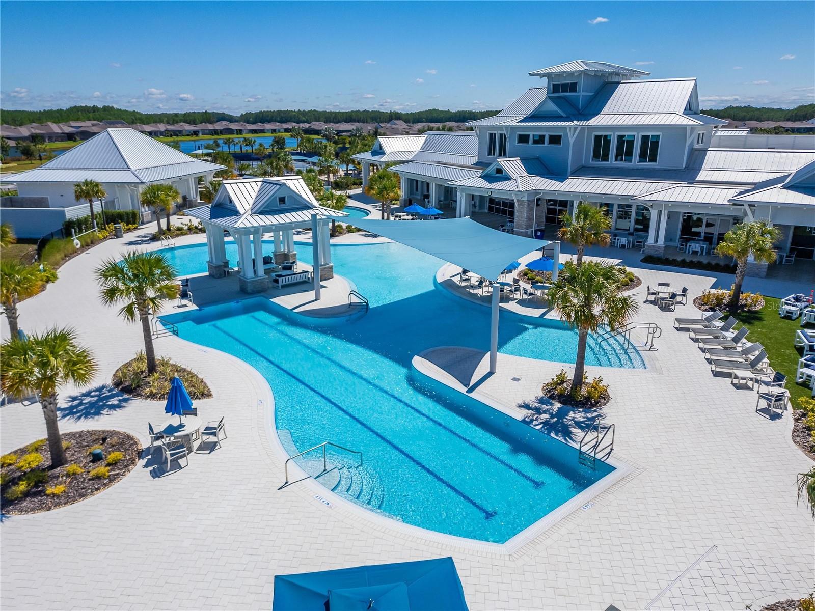 Lounge chairs and Umbrella tables to enjoy poolside snacks