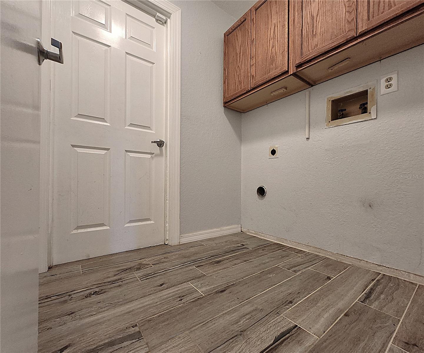 Inside Laundry Room includes closet, washer & dryer hook-ups, cabinets