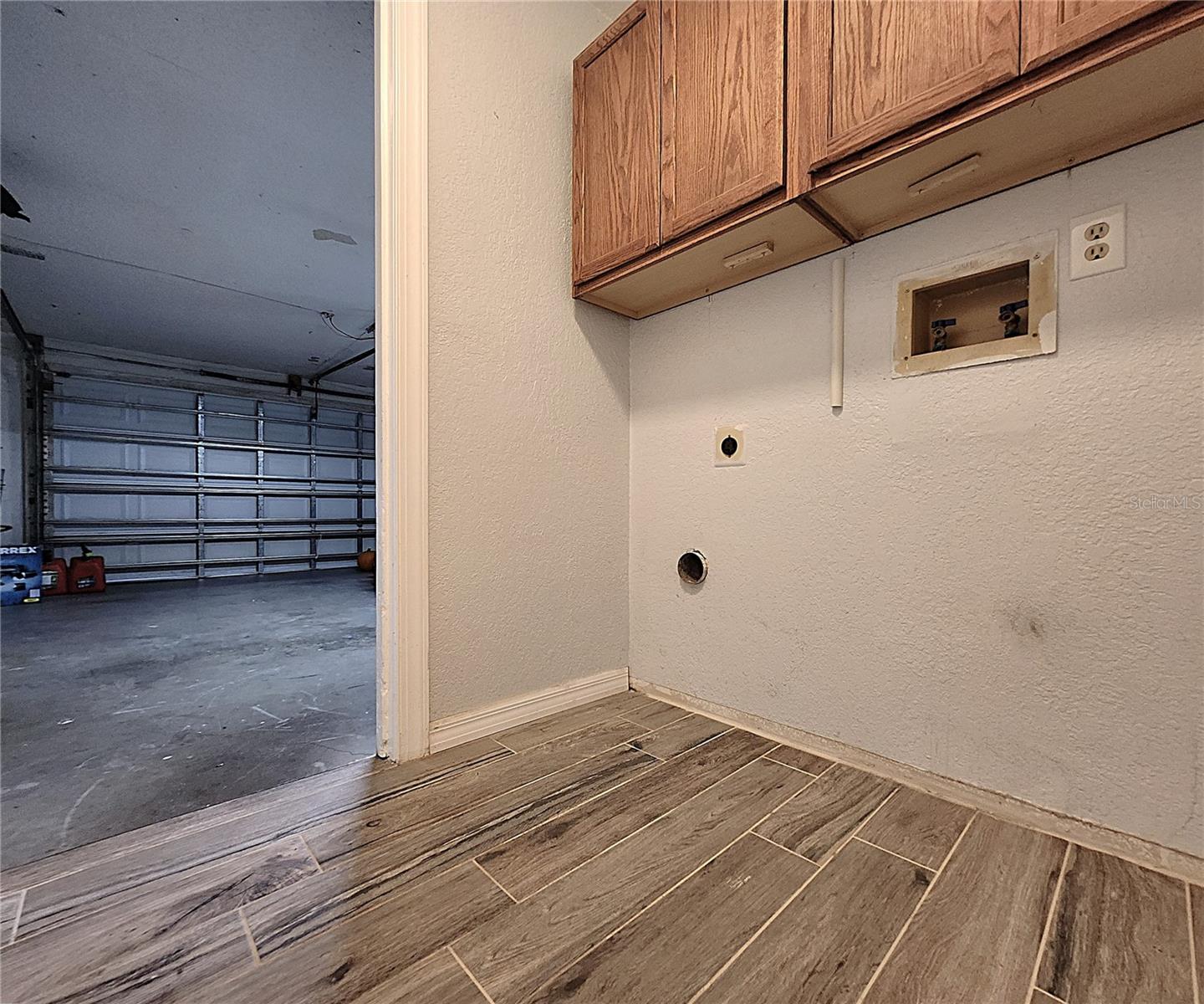 Inside Laundry Room includes closet, washer & dryer hook-ups, cabinets