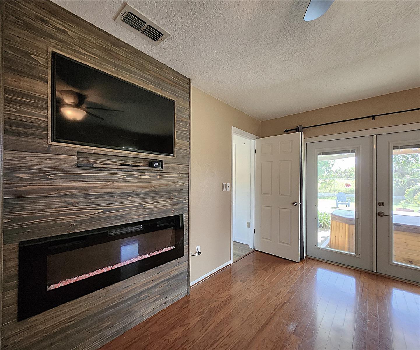 Master includes en suite bathroom, electric fireplace, double doors leading to the lanai & spa