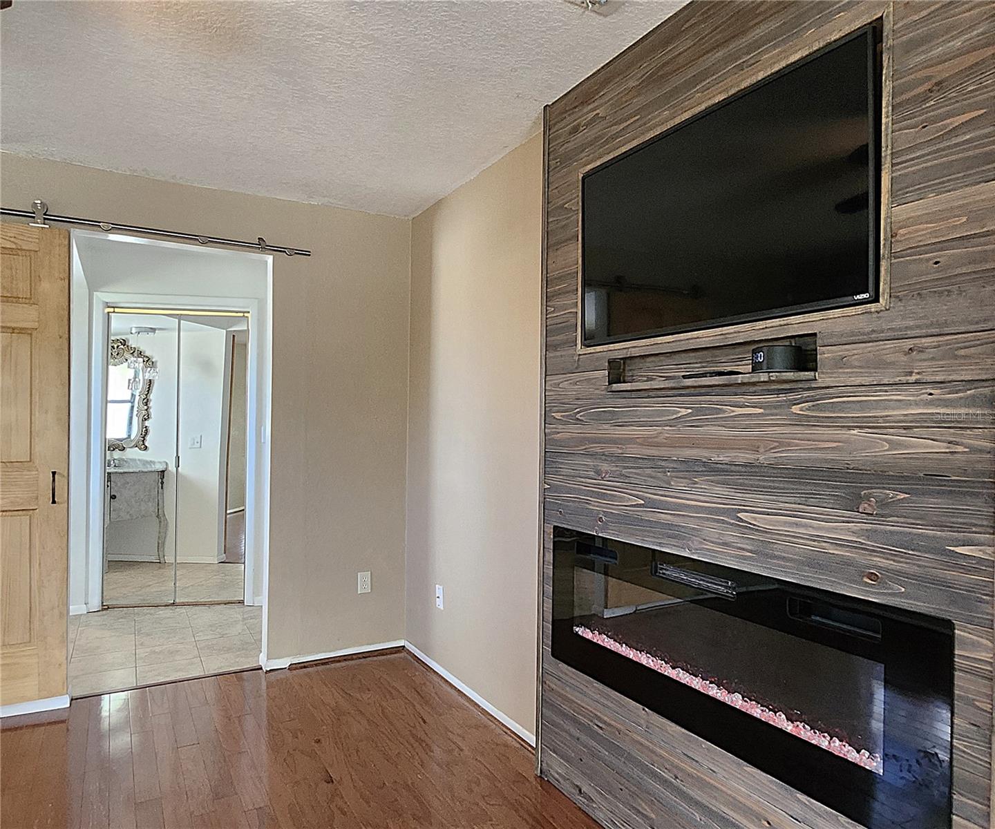 Master includes en suite bathroom, electric fireplace, double doors leading to the lanai & spa