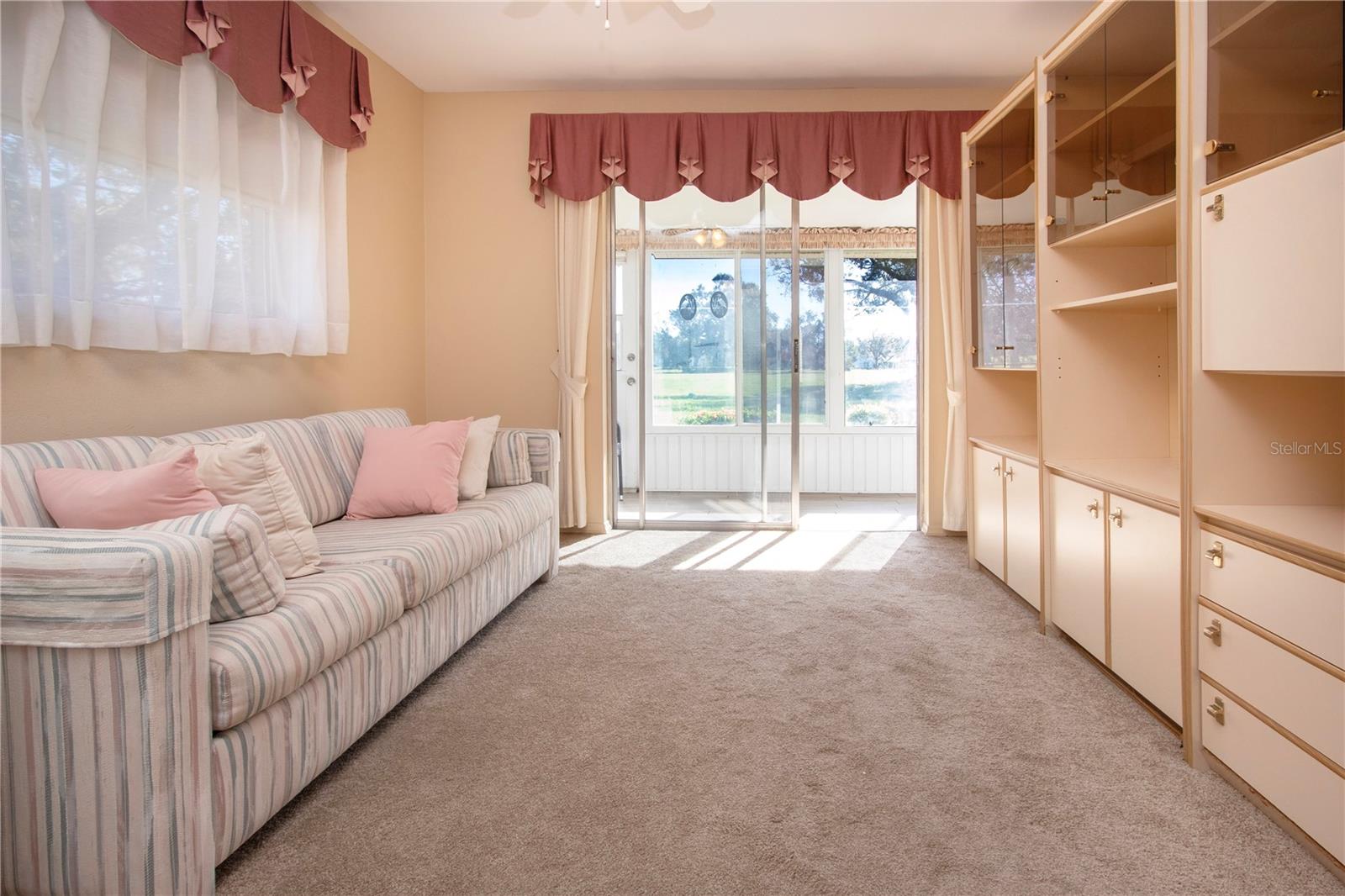 2nd bedroom leading to enclosed lanai