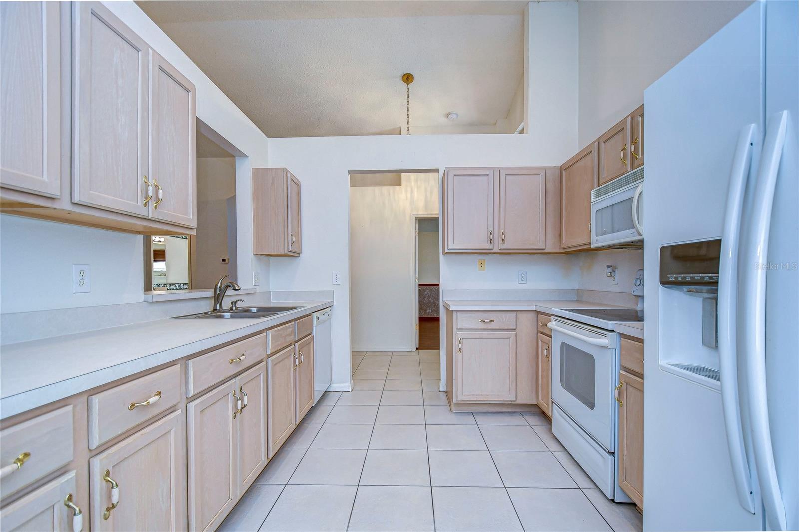 Kitchen features plenty of cabinets & counter space!