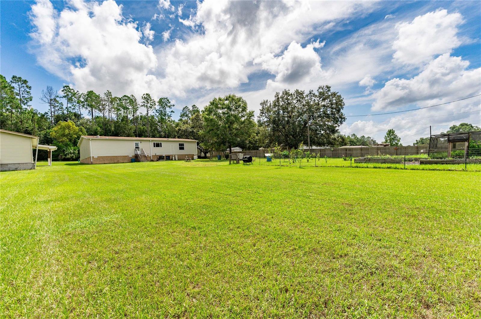 A huge back yard with gardens.