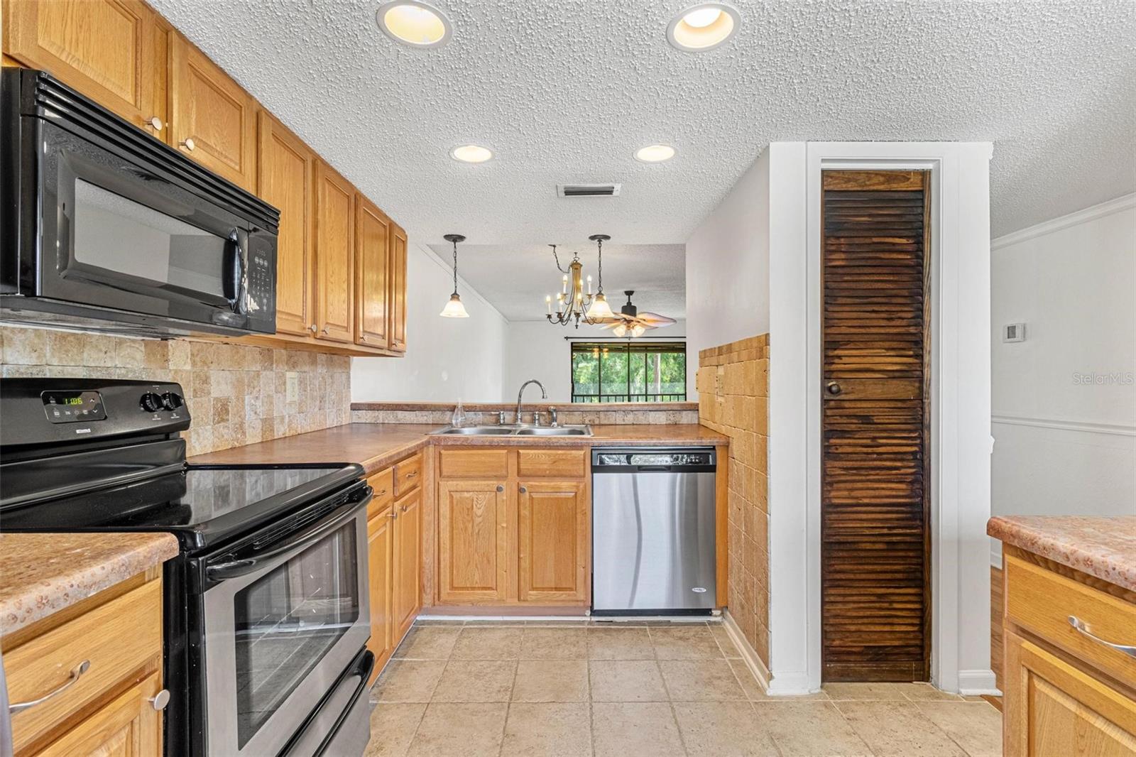 Kitchen with pantry, island and breakfast bar