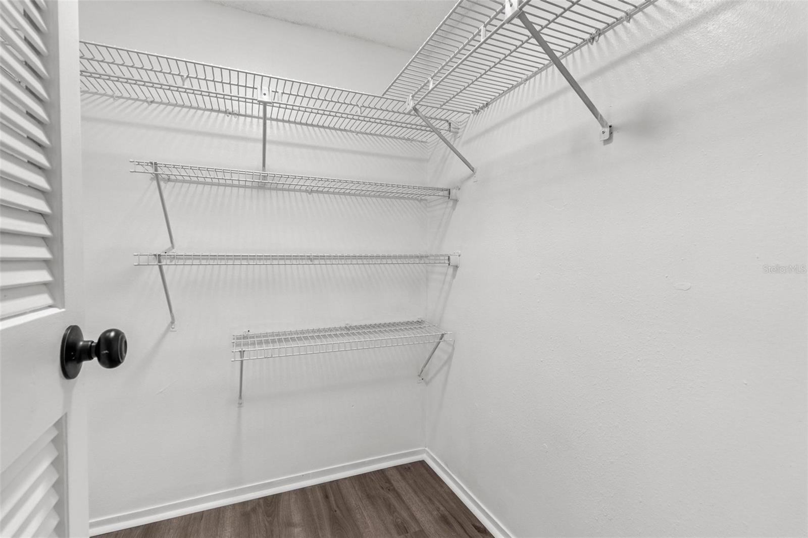 Primary bedroom walk-in closet #1