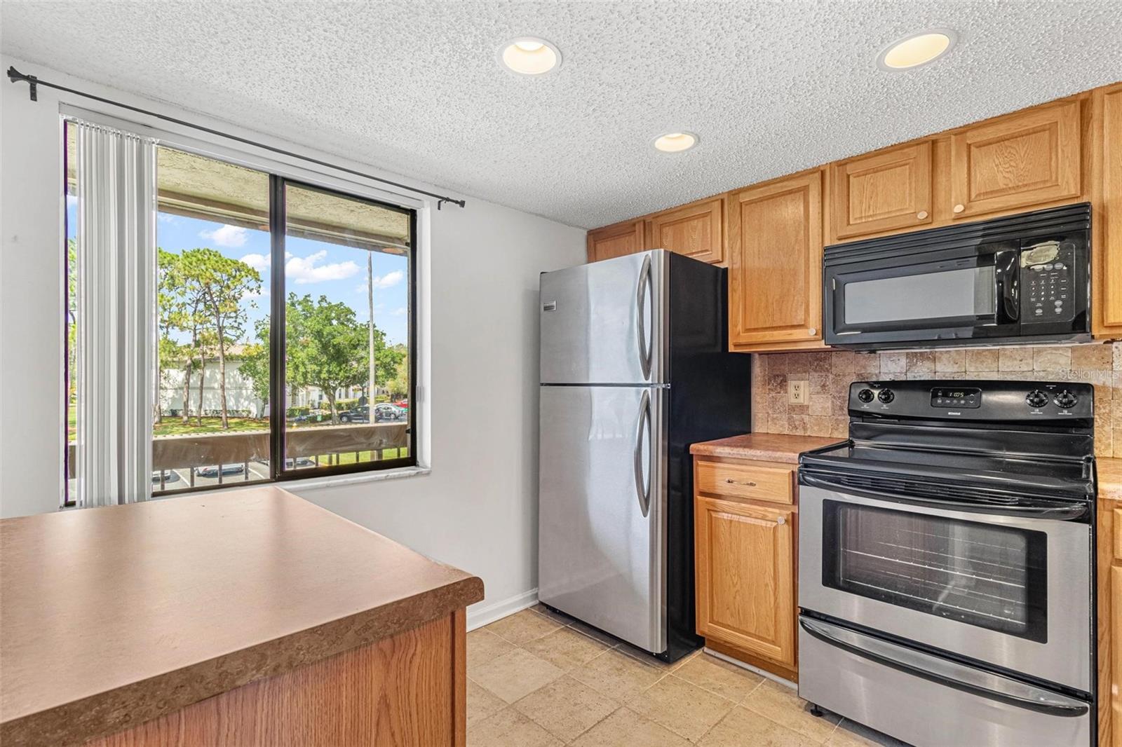 Kitchen with pantry, island and breakfast bar