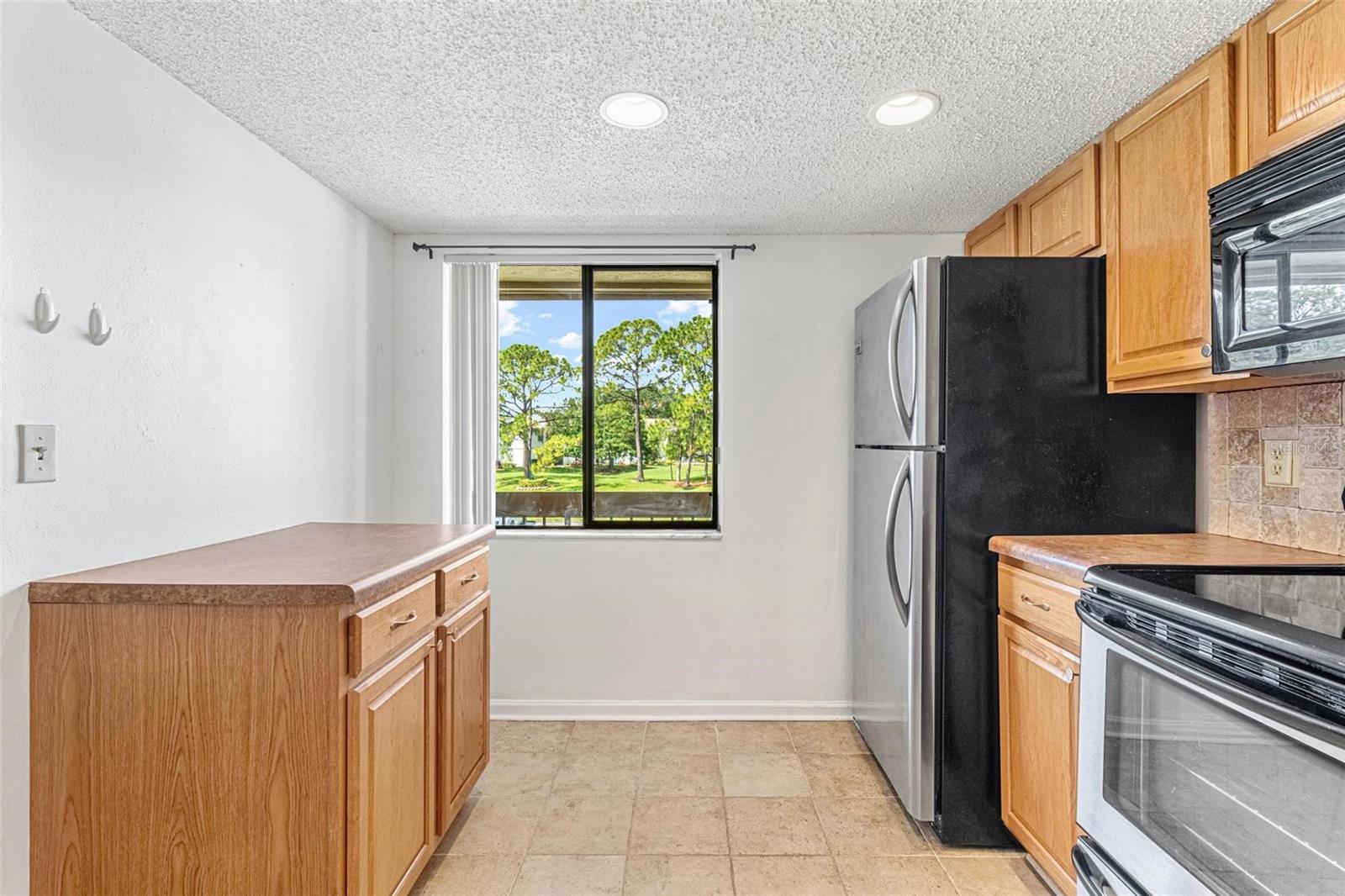 Kitchen with pantry, island and breakfast bar