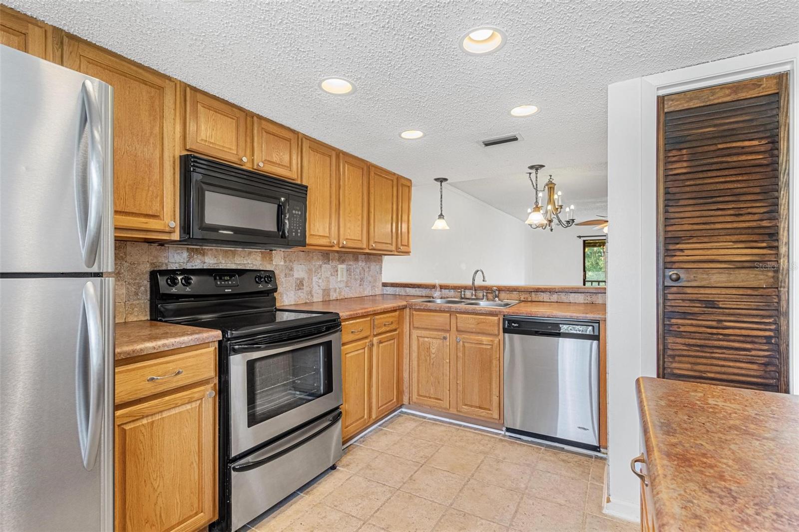 Kitchen with pantry, island and breakfast bar