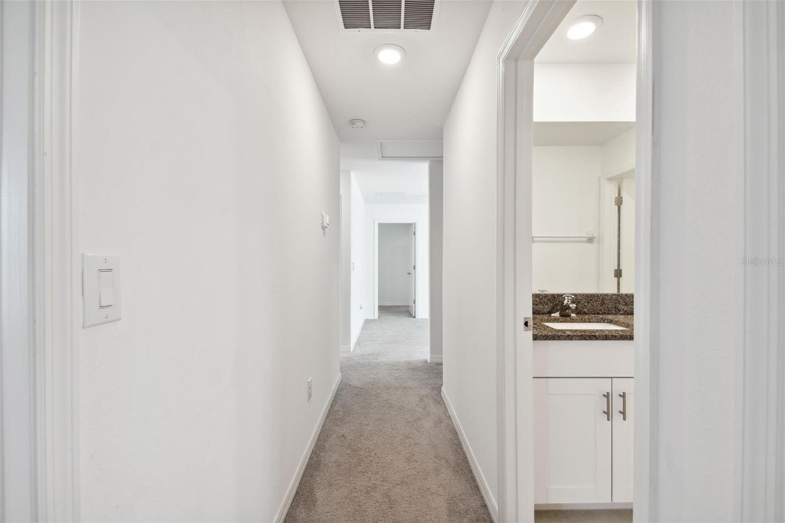 HALLWAY WHICH LEADS FROM UPSTAIRS BACK BEDROOM