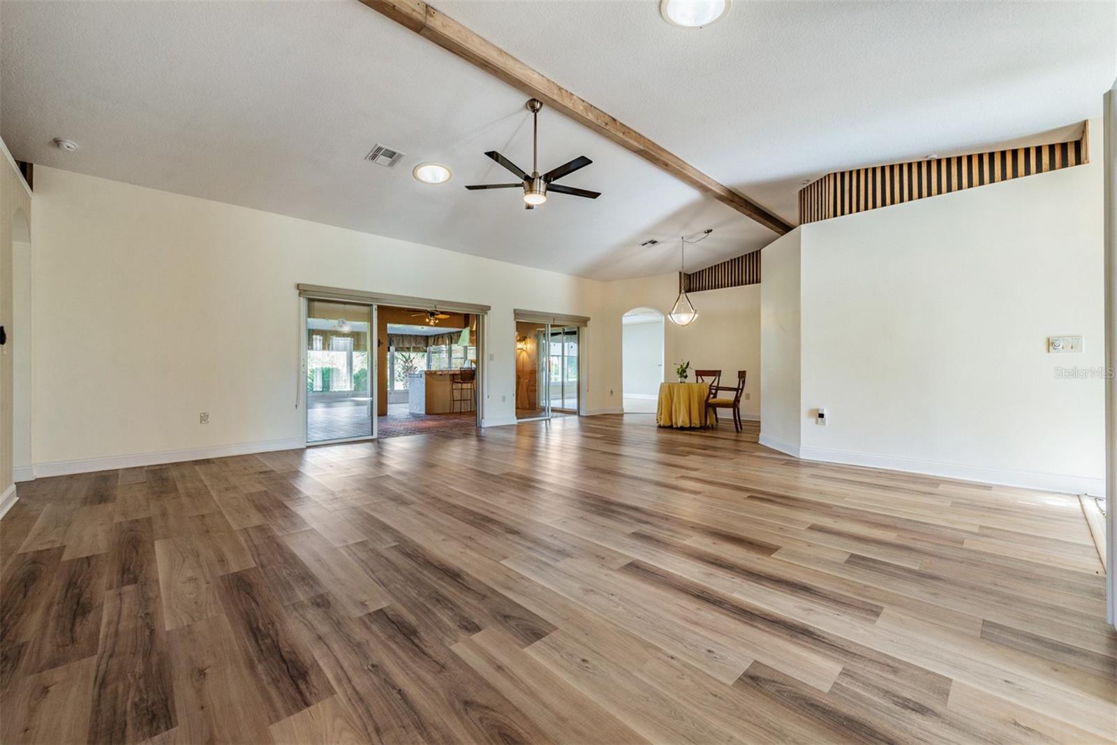 Living/Dining Room with Striking floors and Cathedral ceiling!