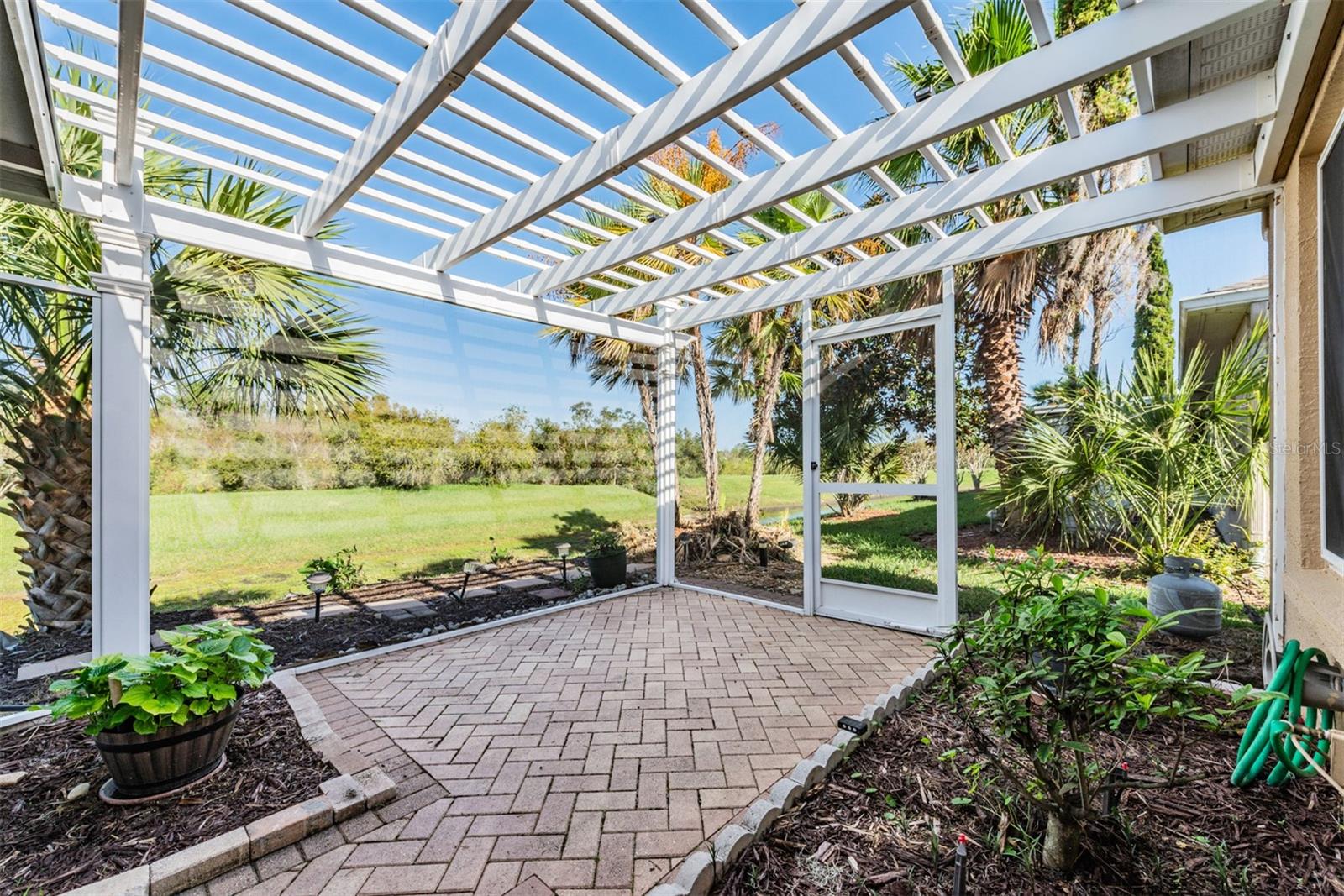 Perfect place for small herb garden in this Screened area with Open Arbor!