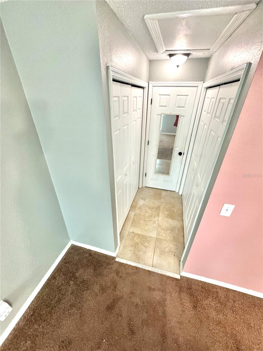 Closets leading to the master bathroom