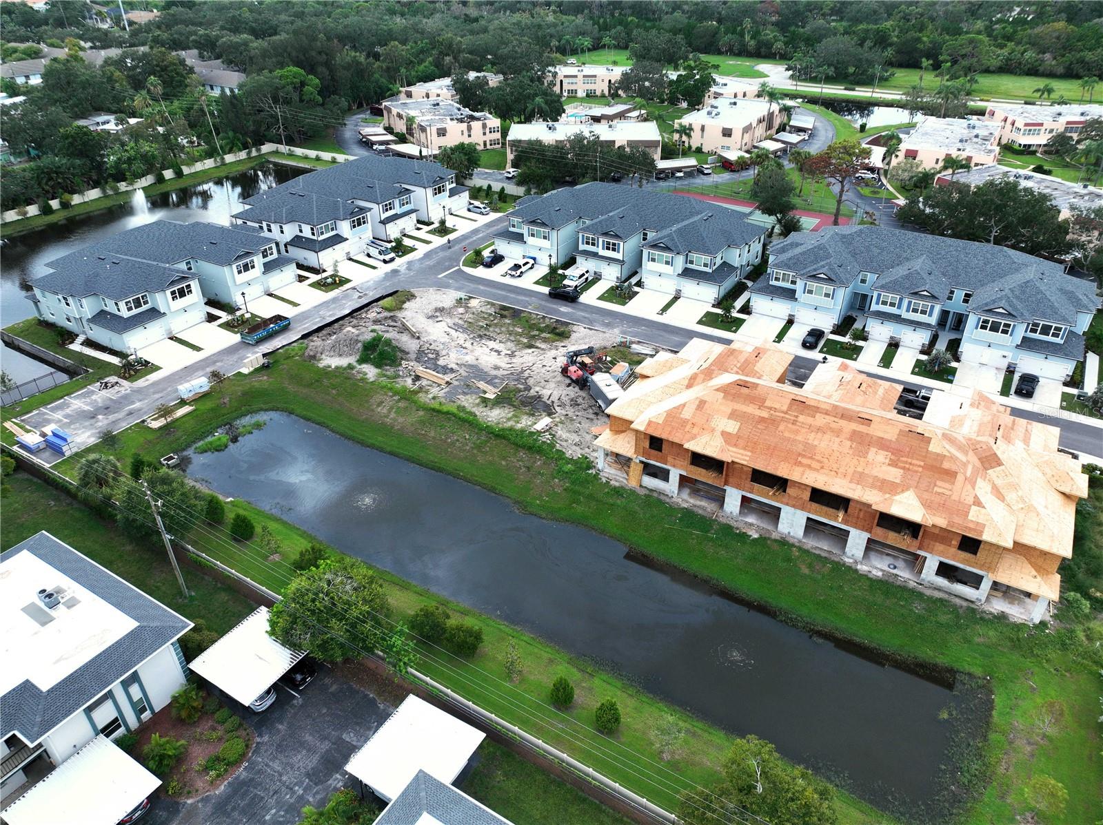 Back of building with view of over flow pond