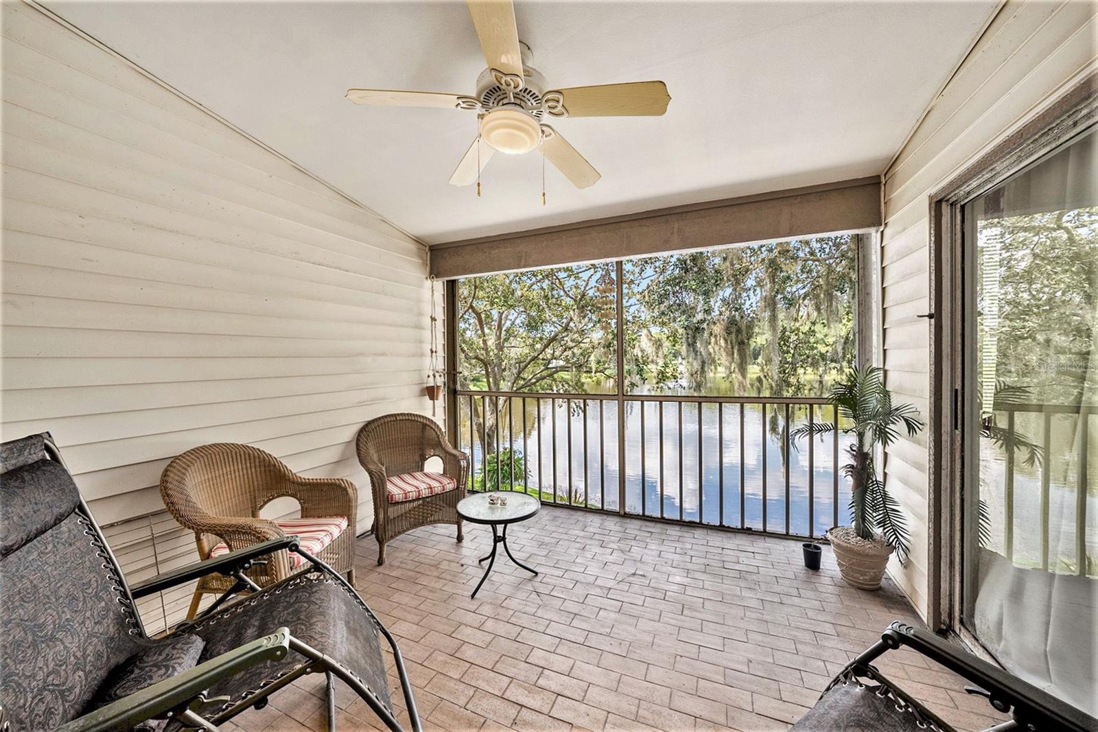 Enclosed Balcony Overlooks Pond