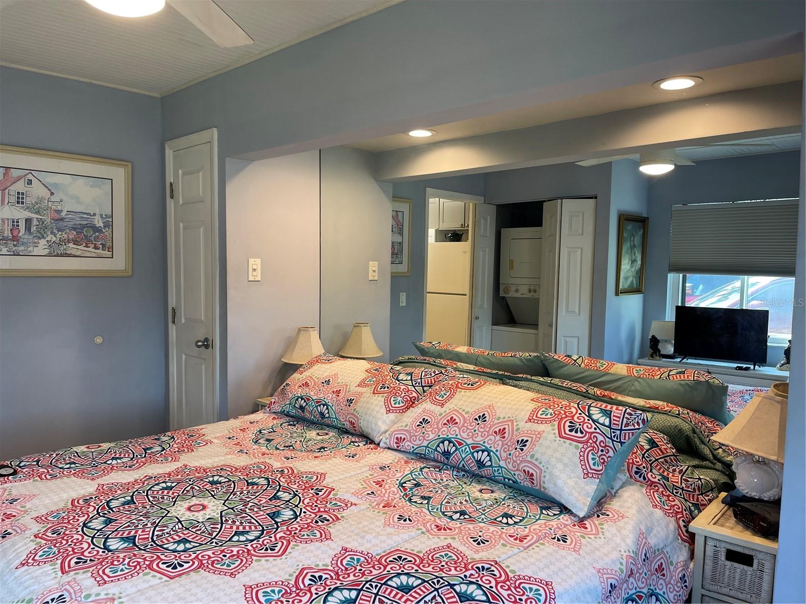 Mirrored accent wall in bedroom.