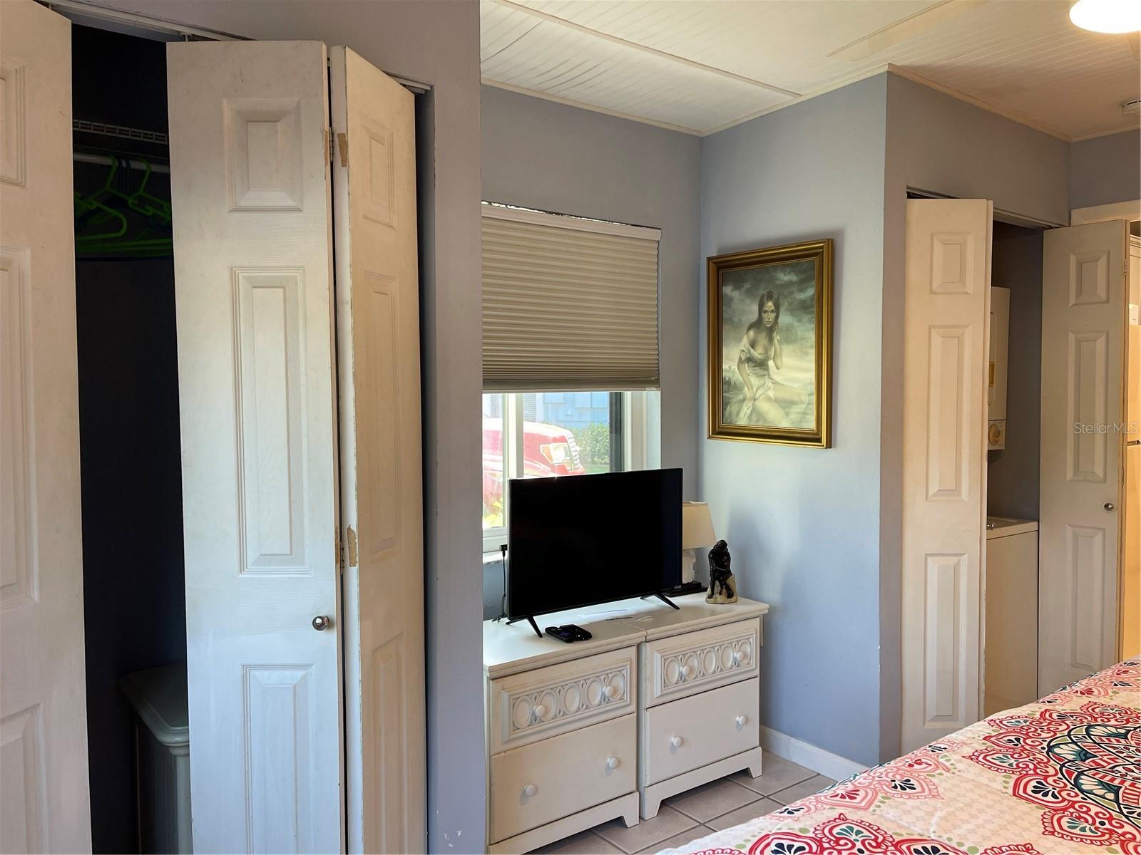 Closet to the right contains the washer and dryer.