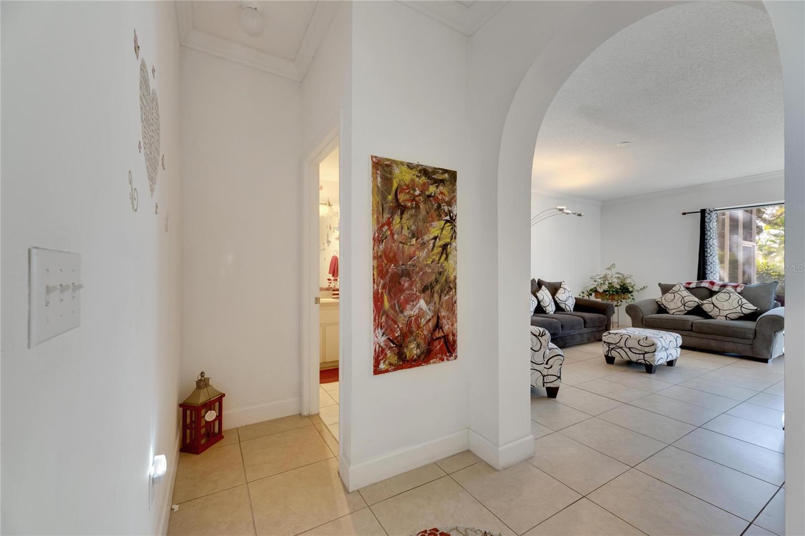 Downstairs Half Bath and Living Room Area