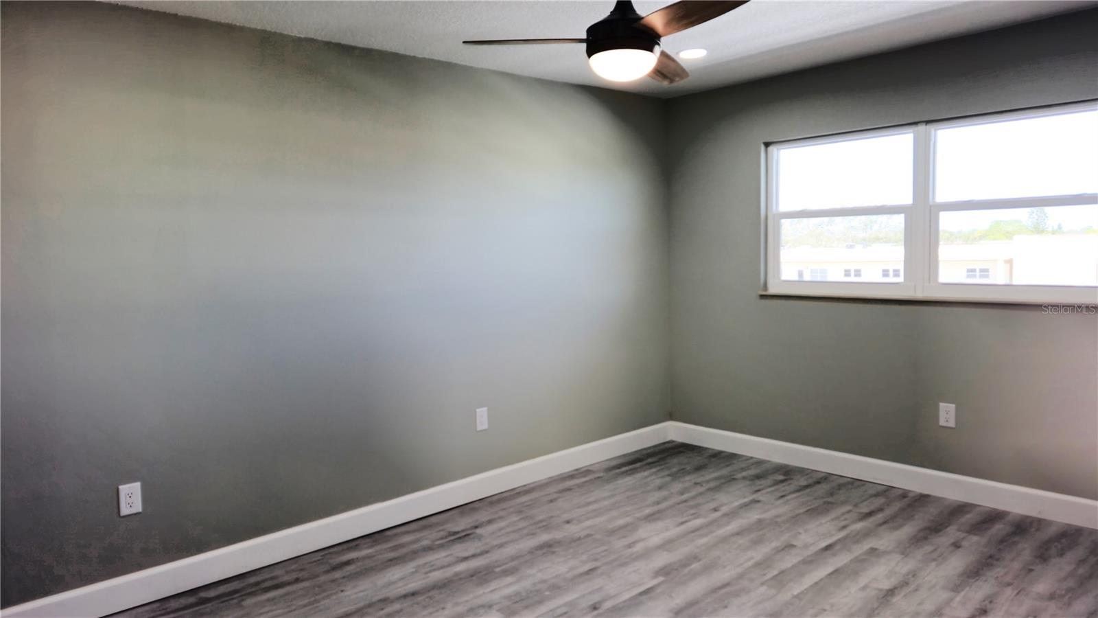 Plenty of natural light in both bedrooms as well as a light on the fan and canned lights