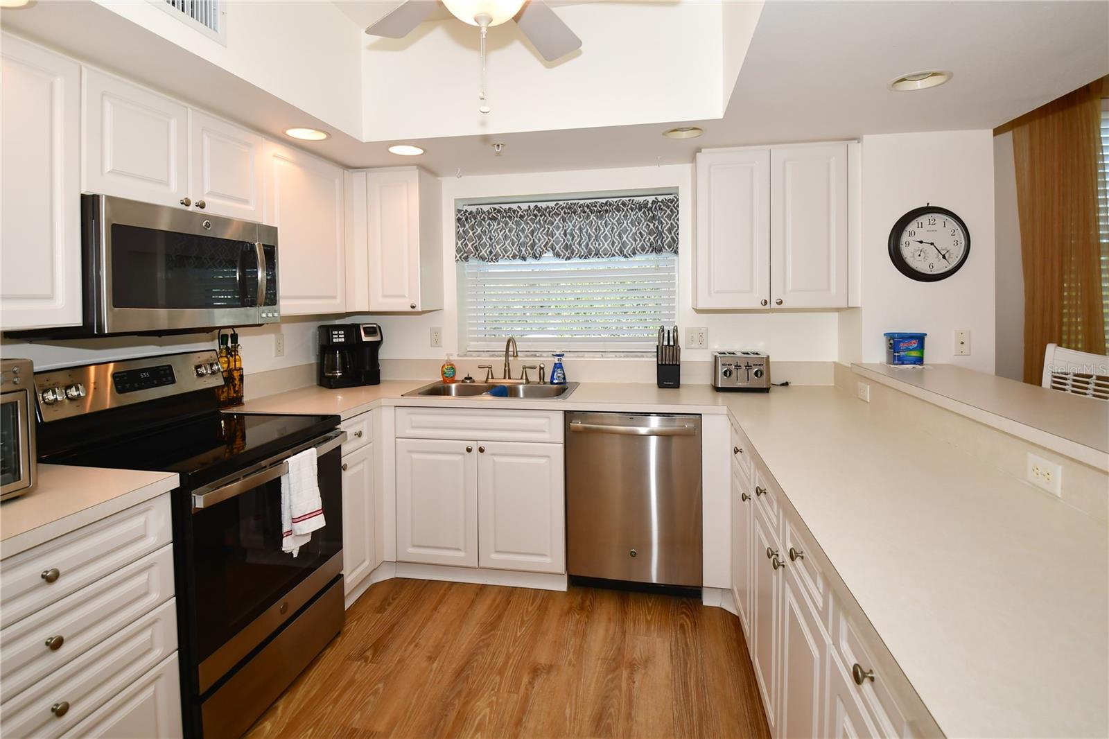The Kitchen, with stainless steel appliances, accommodates lots of cabinets and counter space.