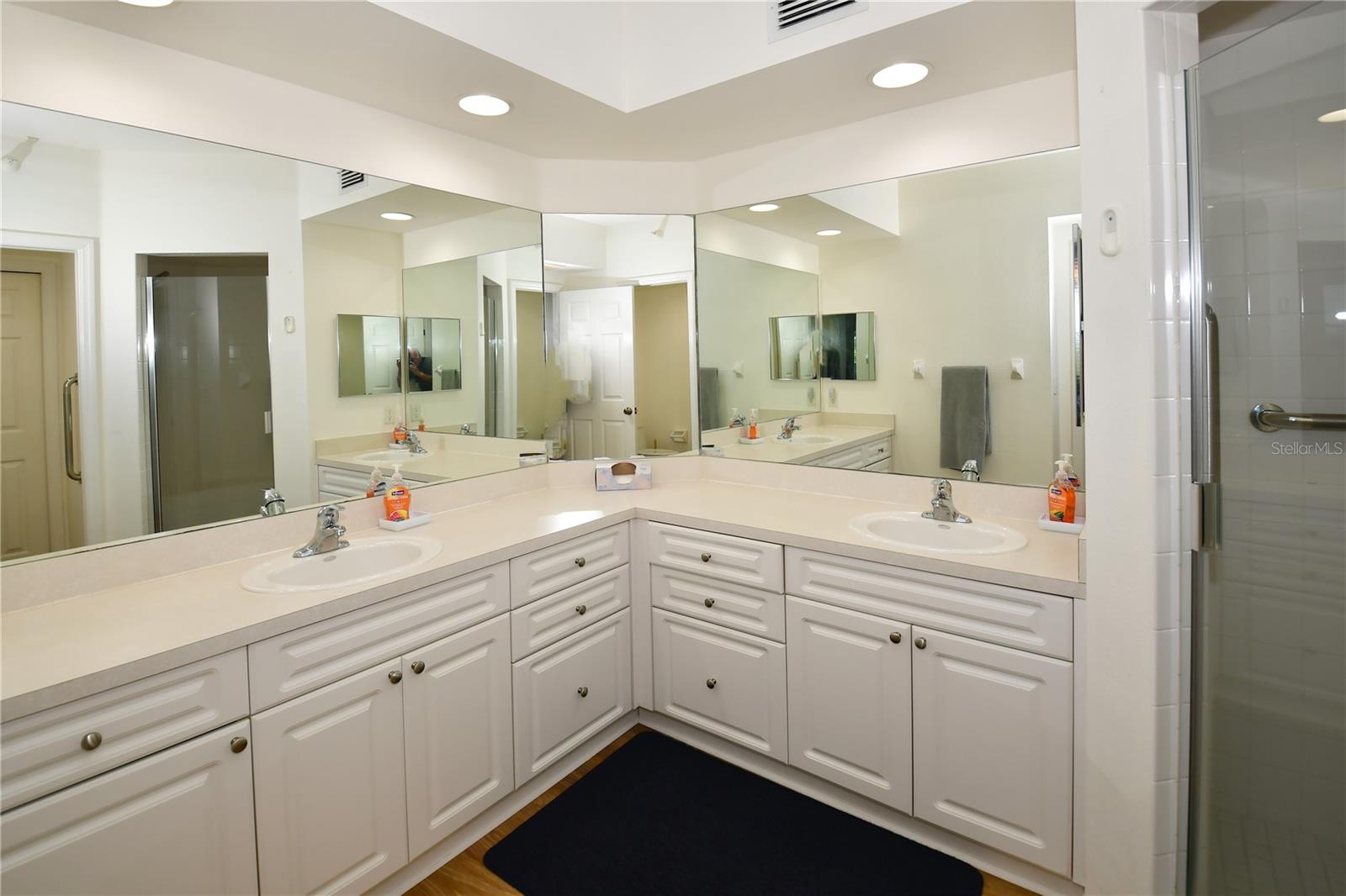 Lovely Primary Bathroom with dual sinks and walk-in shower.