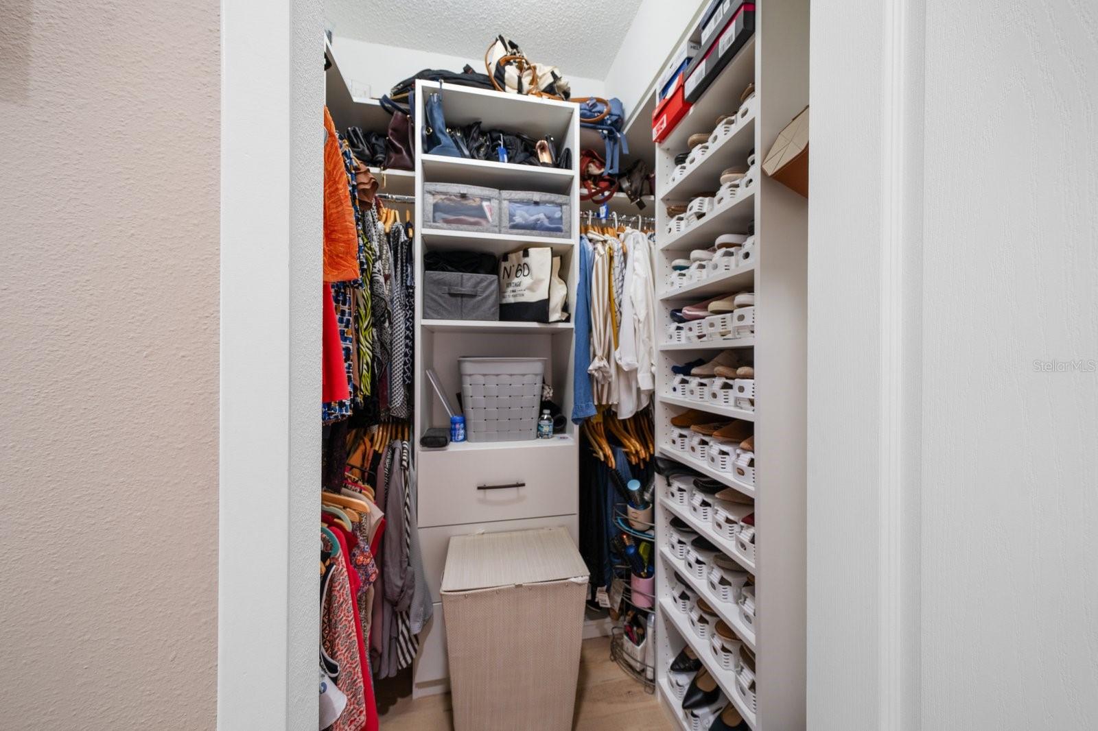 Primary walk-in closets with closet systems