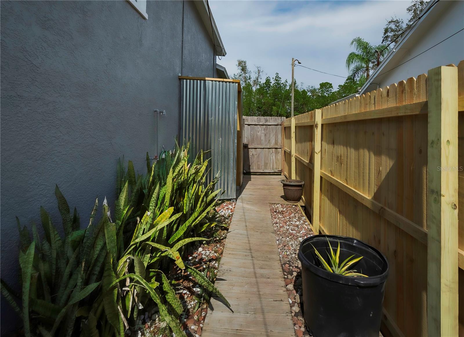 Walk around to the outdoor shower