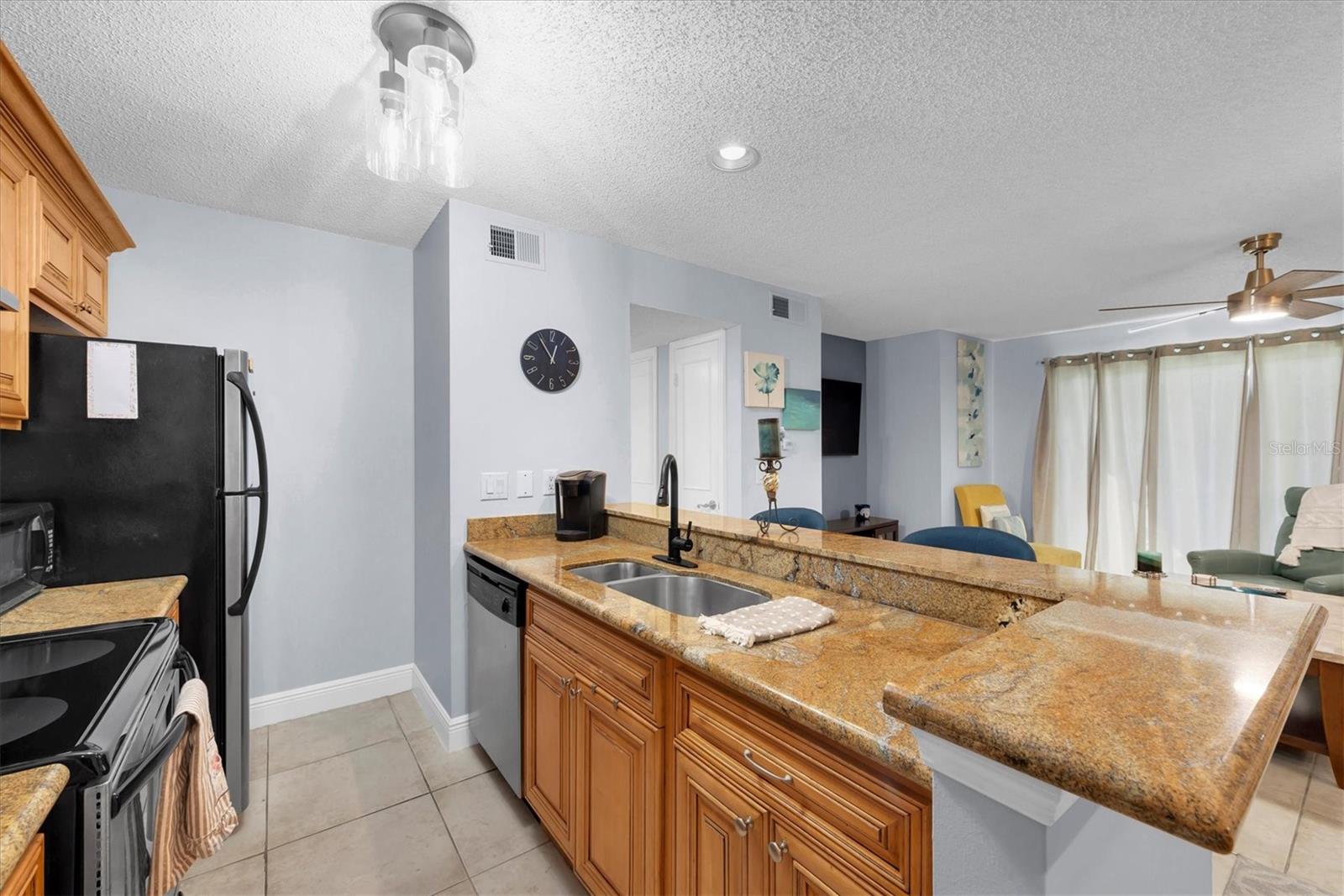 Kitchen and living room both overlooking a long lake view