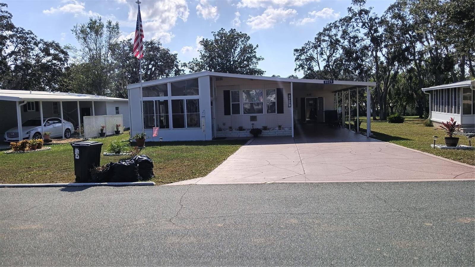 Spotless epoxy coated driveway accomodates 2 vehicles.