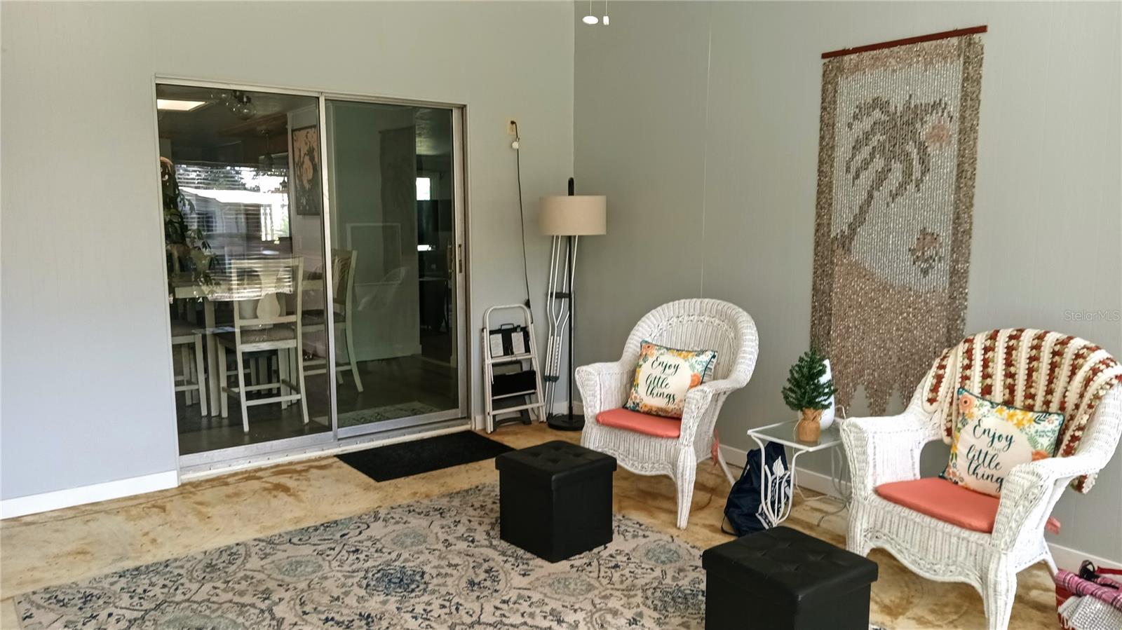 Sliding glass door from dining room leads to the back Florida Room.