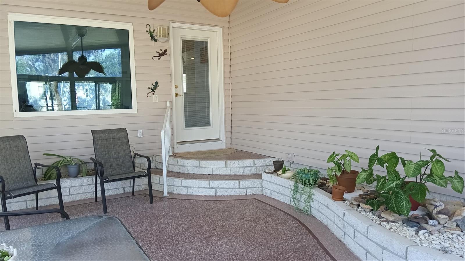 Enclosed front porch has a vaulted ceiling, and is a great place to have coffee and watch the sun rise.