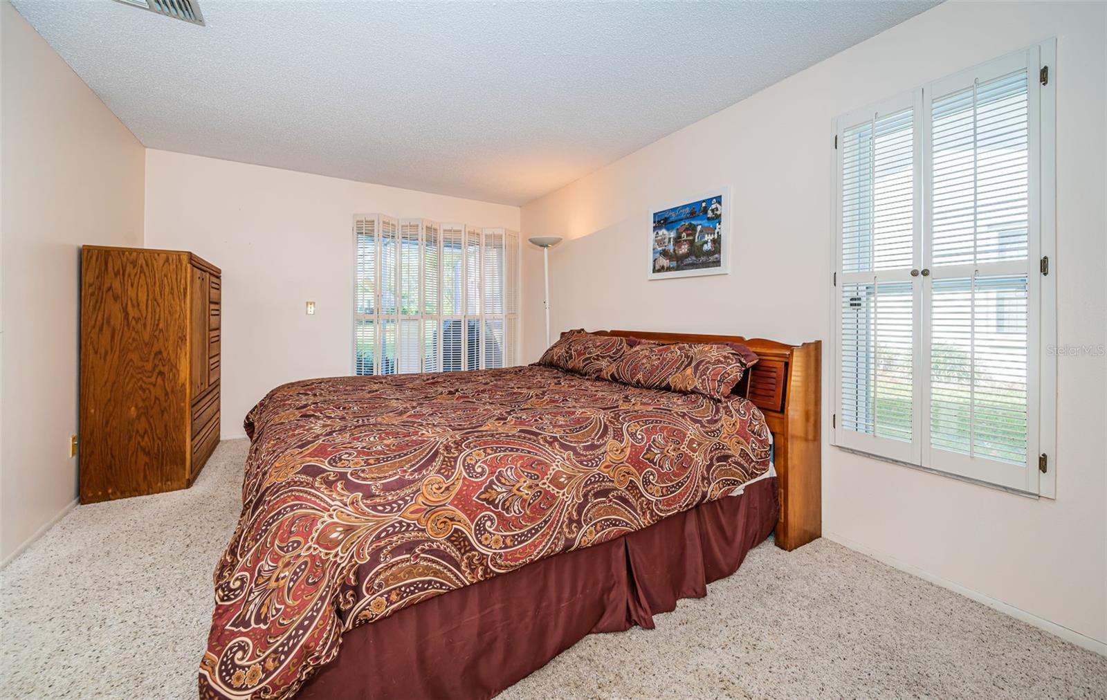 Primary bedroom with sliders to lanai