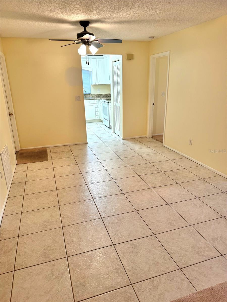 Designated dining area between living room and kitchen.