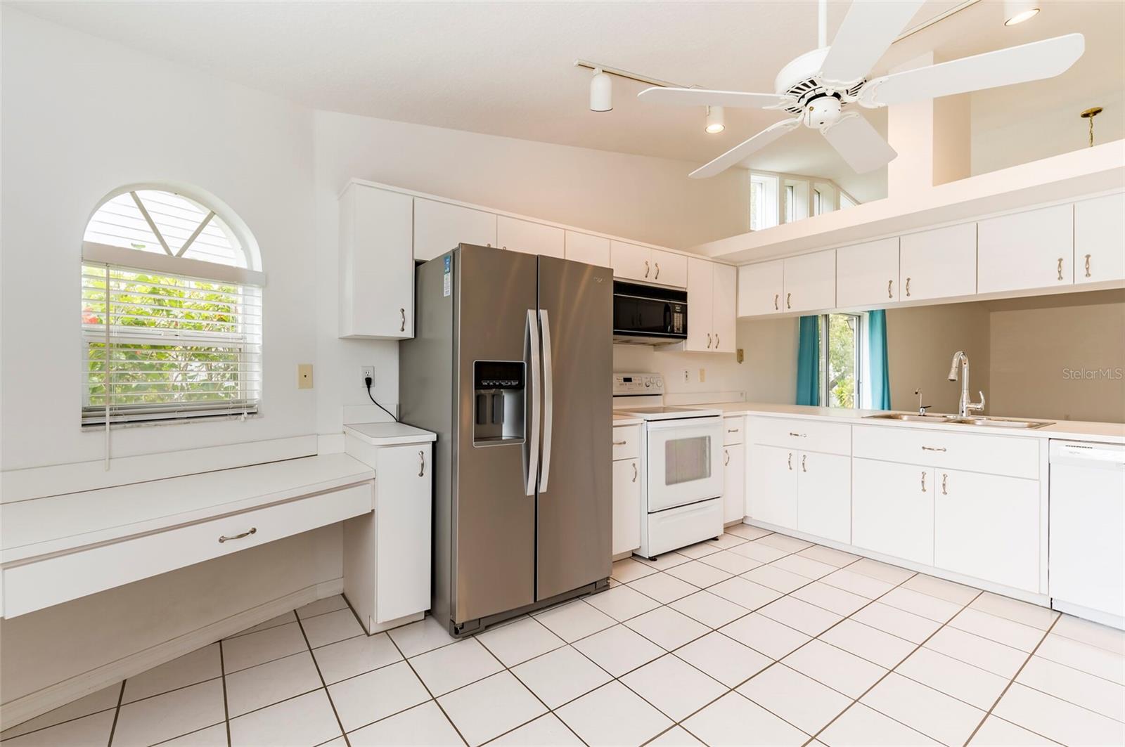 Kitchen with new Stainless Steel French Door Refrigerator