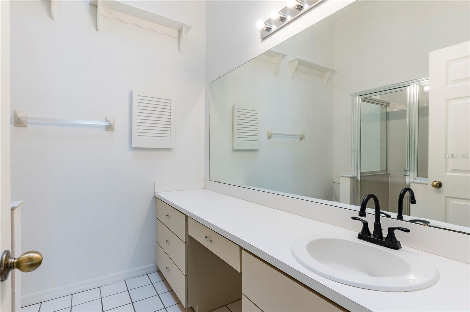 Primary Bathroom with Double Vanity and Skylight