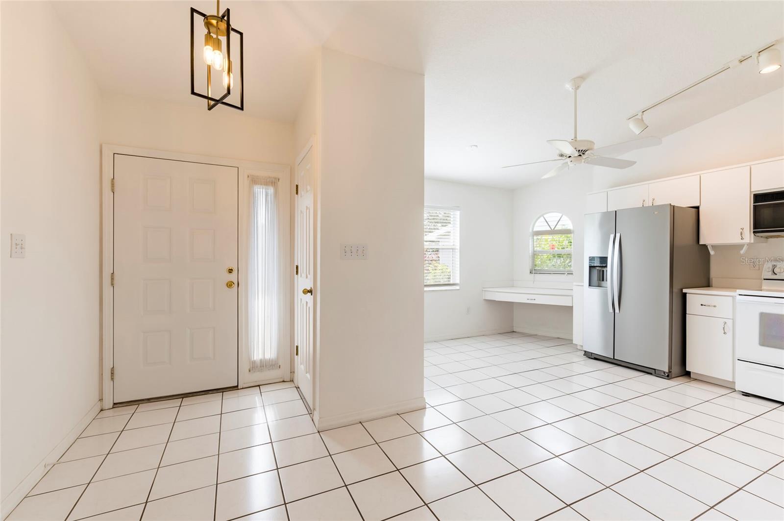 Interior Entrance Foyer and Kitchen Partial View