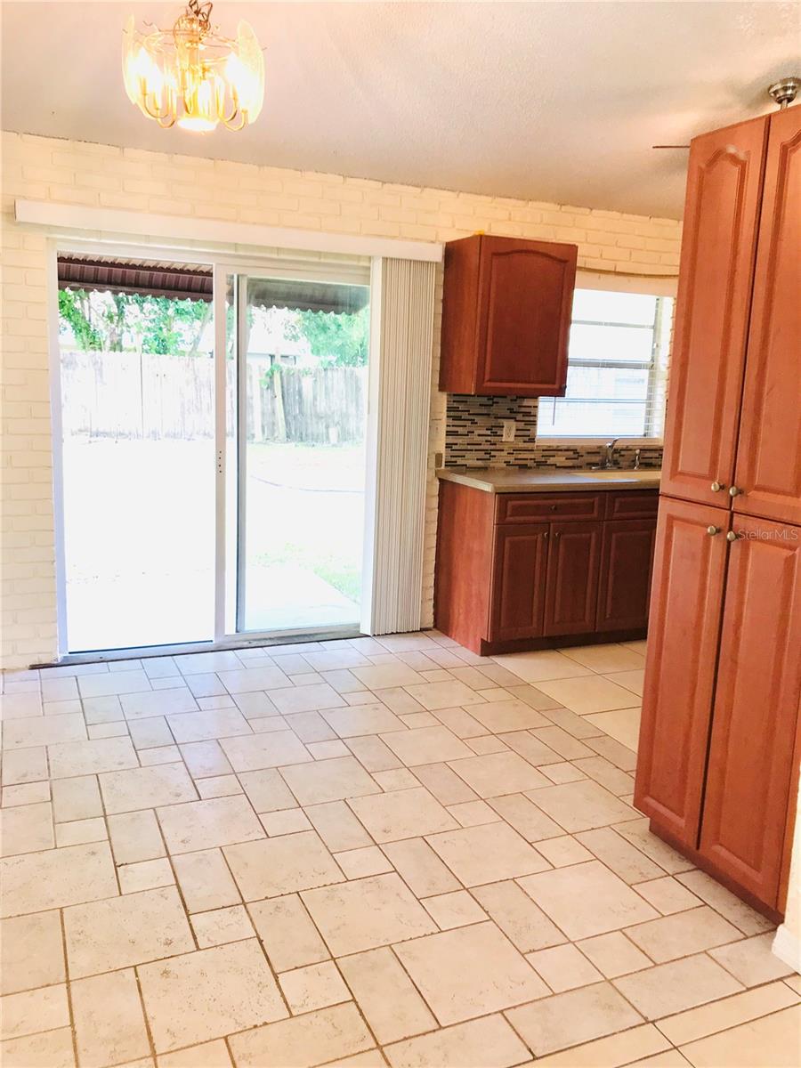 Dining Area From Living Room To the Backyard through the Sliding Door