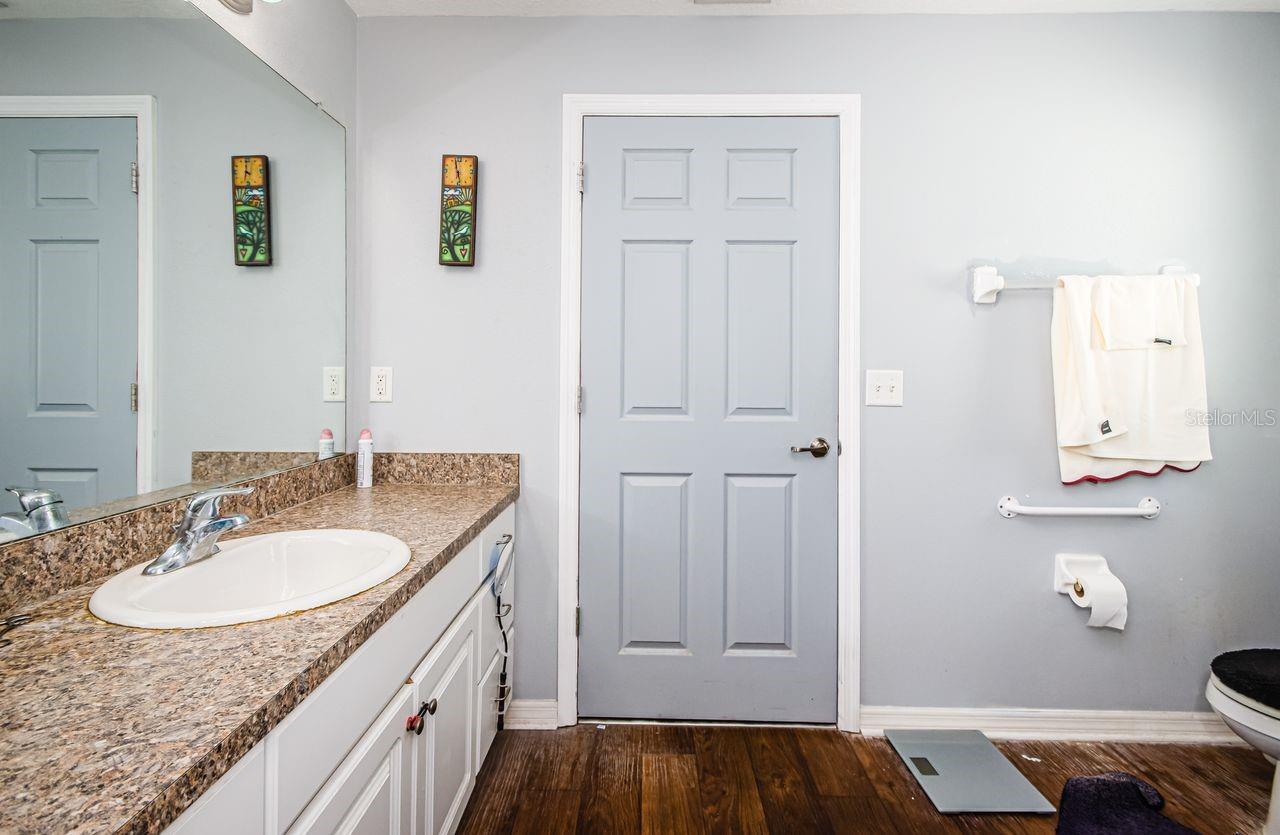 Plenty of room in this master bath. Door leads to spacious walk-in closet