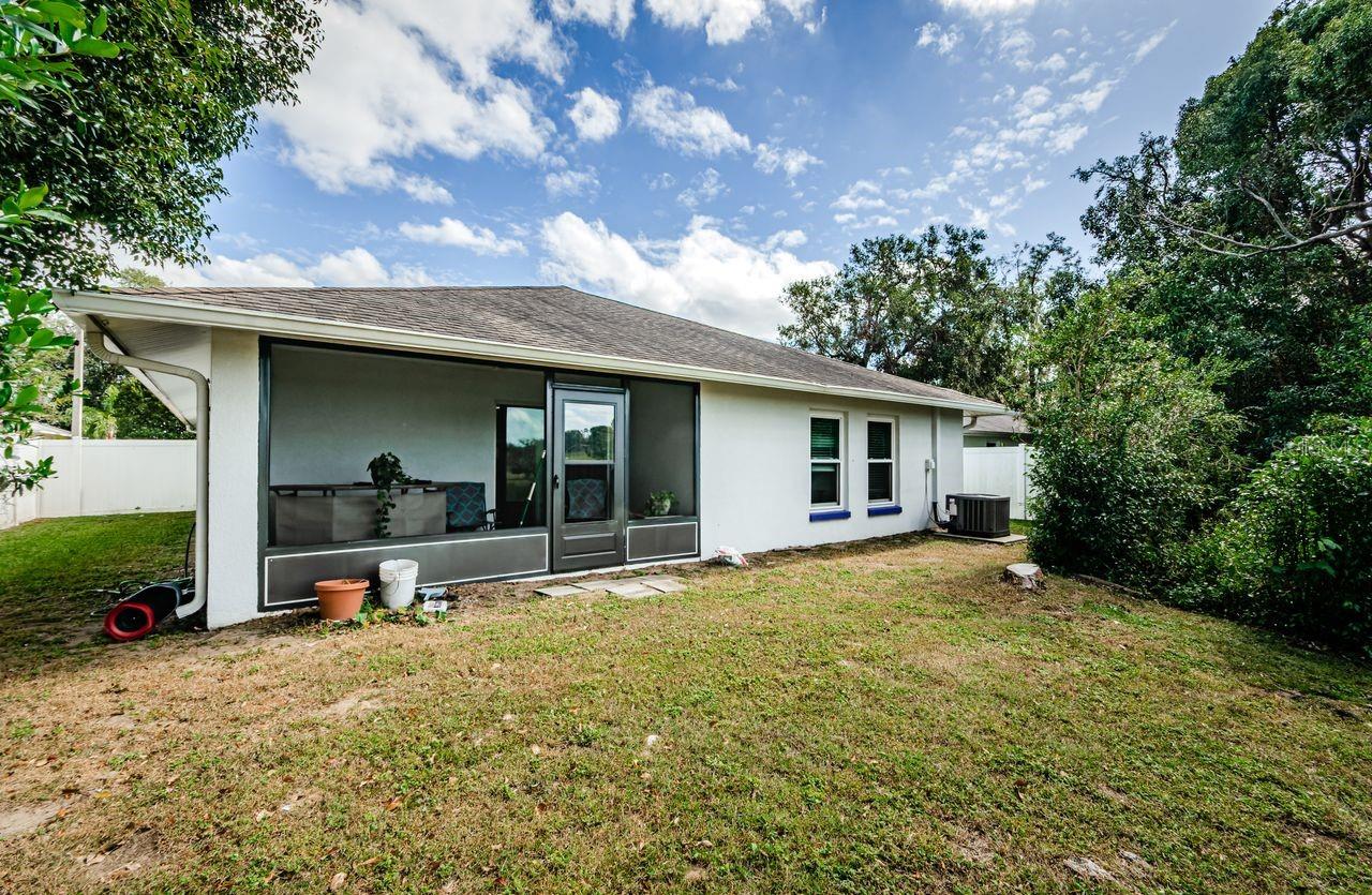 Enclosed back patio offers a great view of the sunset.