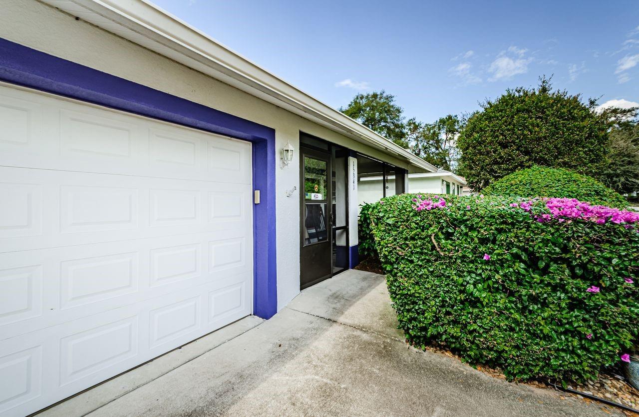 Greet guests on your screened-in front porch