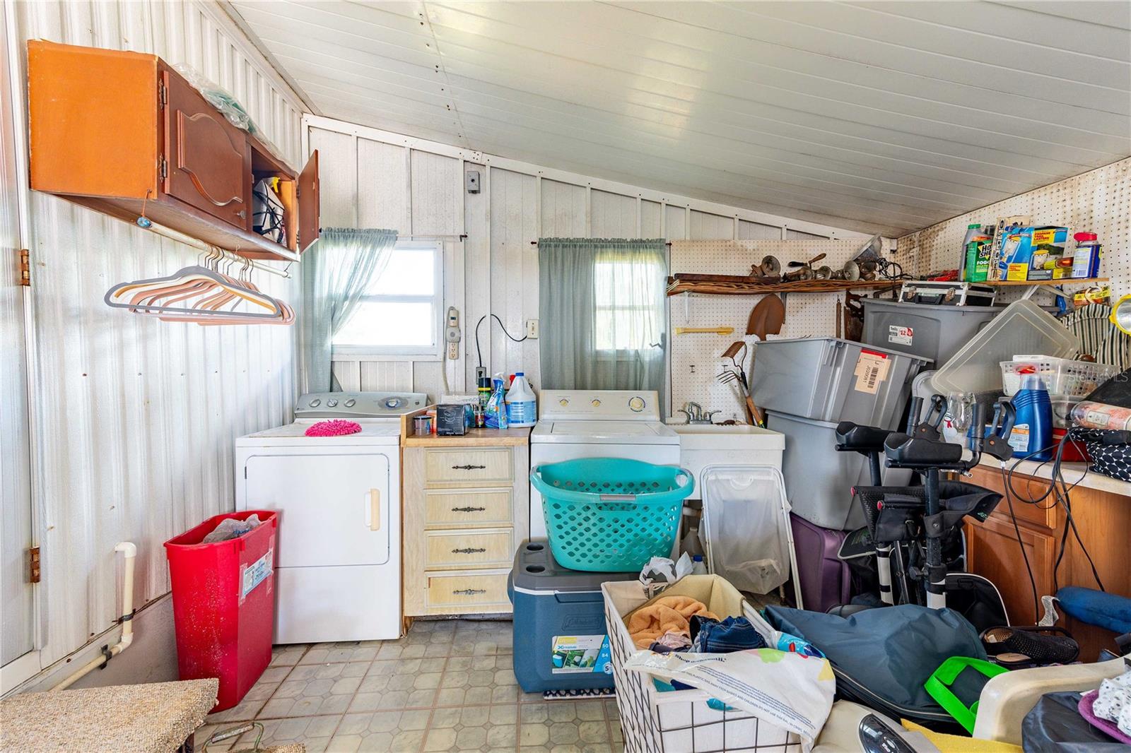 Nice sized storage and laundry area.