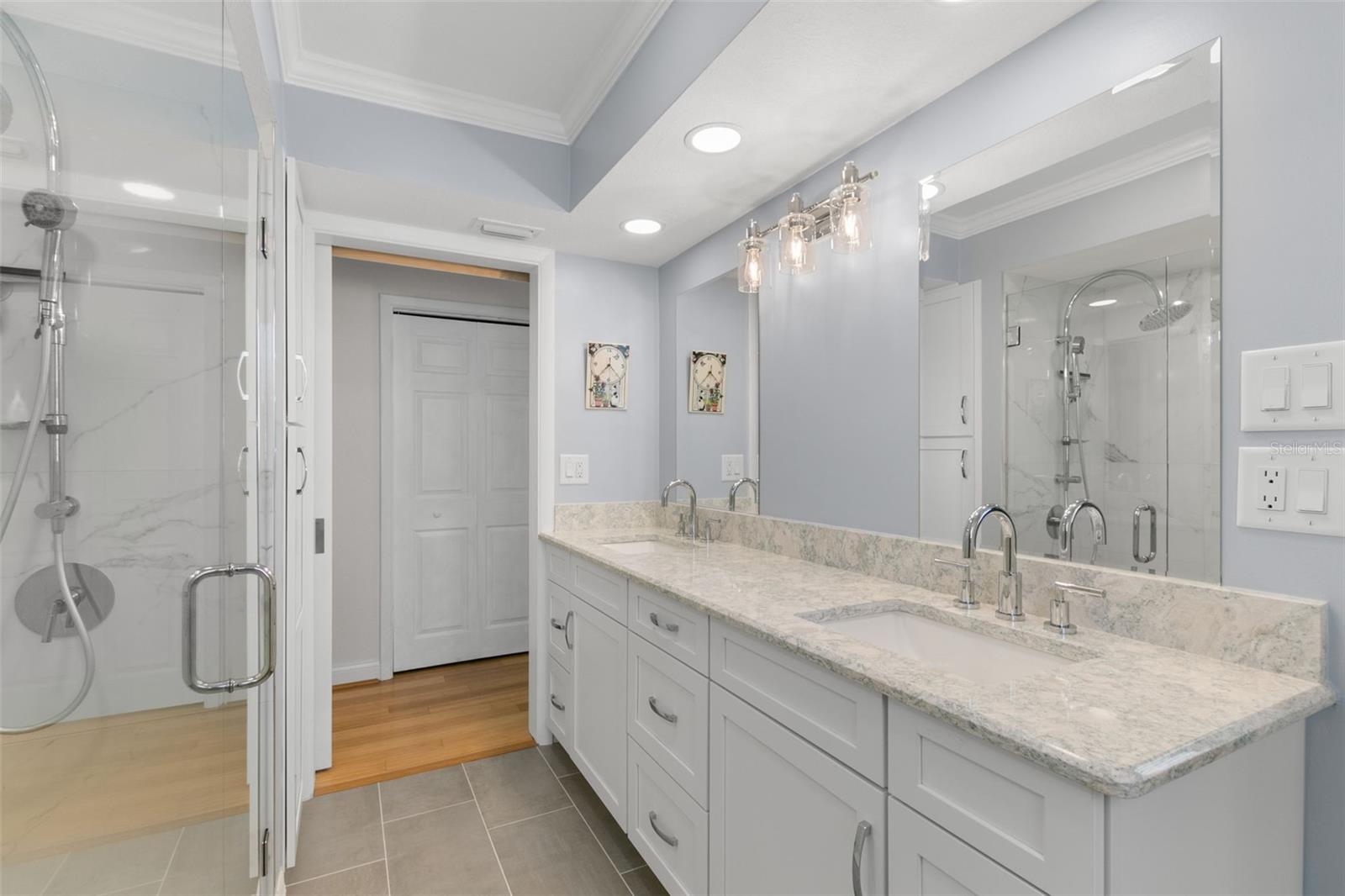 Primary Ensuite Bath with Double Vanity and Walk in Shower.