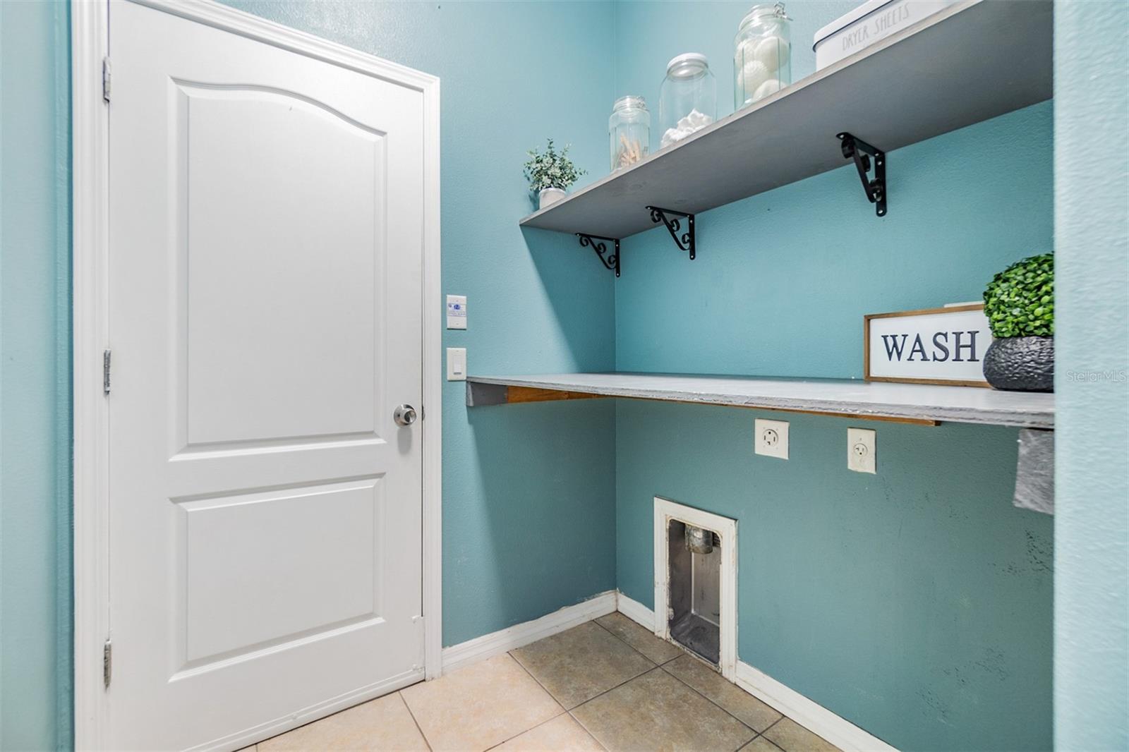 laundry room leading to garage