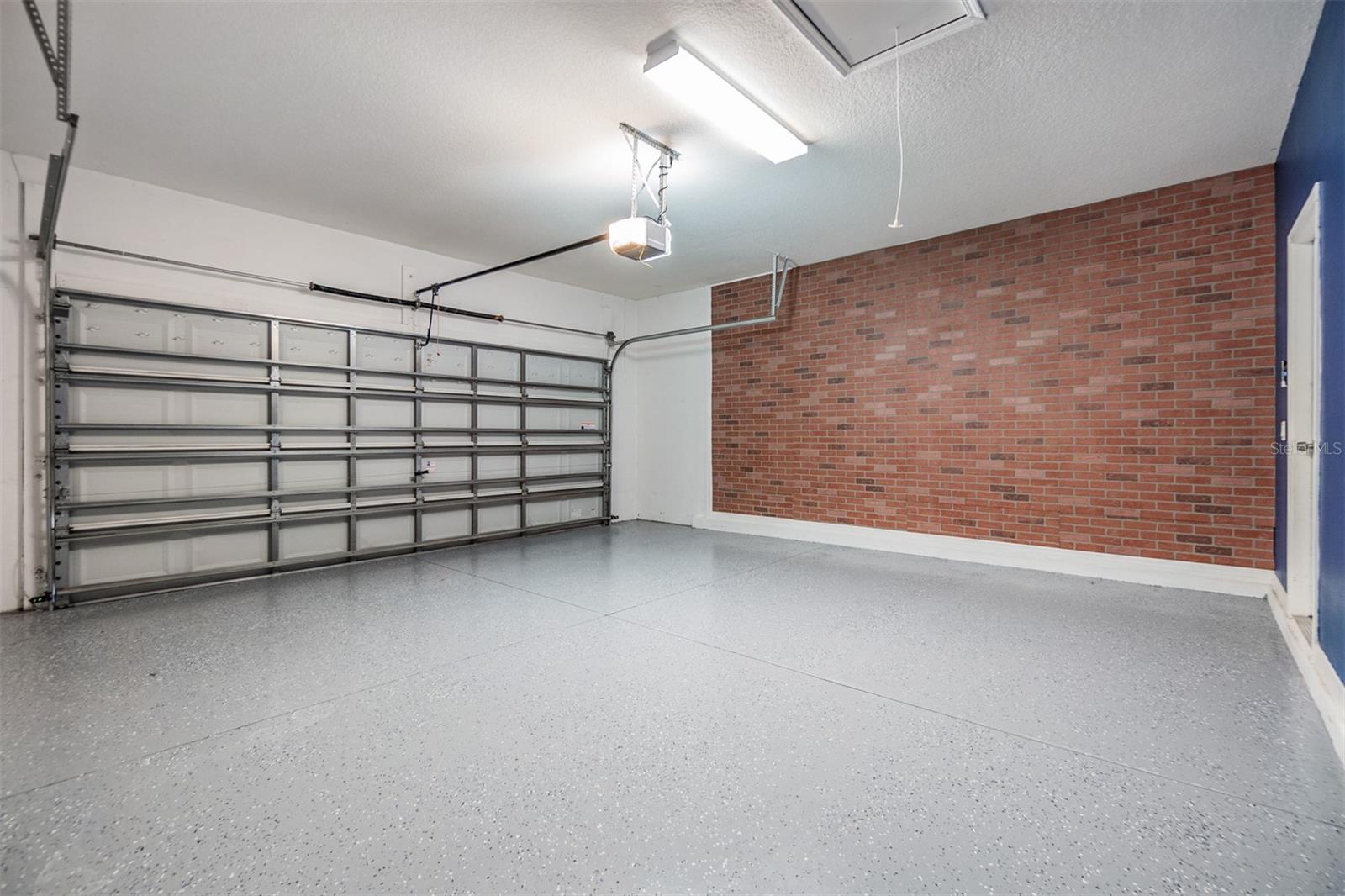 garage with its own AC unit installed