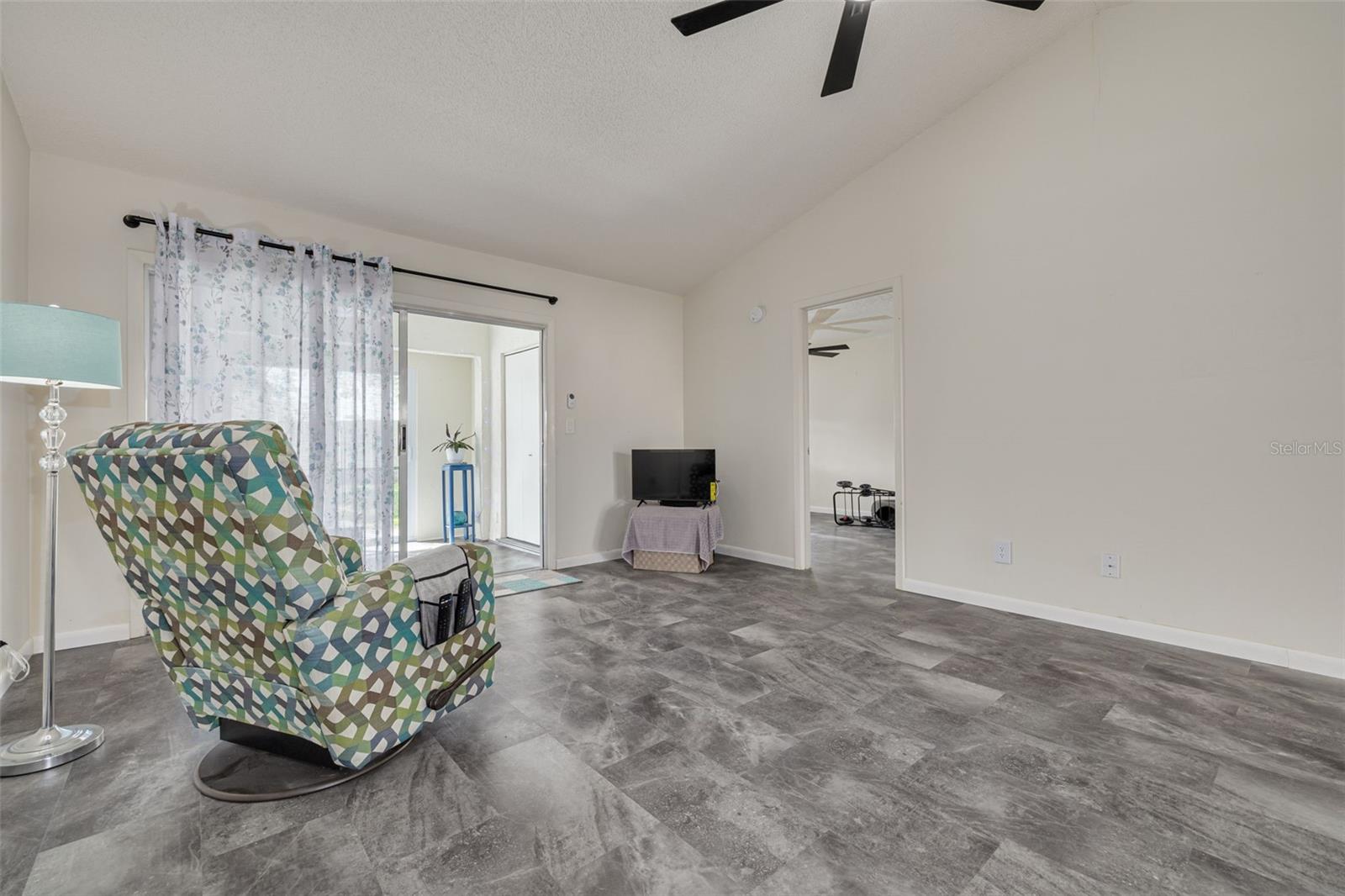 Living Room with Entrance to Florida Room (Heated & Cooled) and Doorway to Primary Bedroom