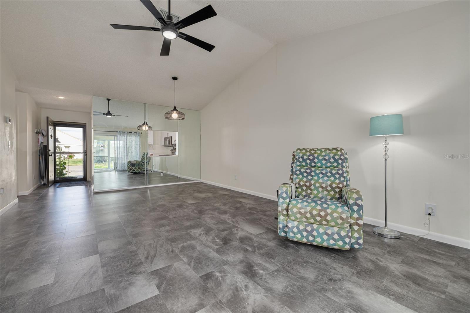 Living Room with View of Unit Entrance with New Storm Door (2020)