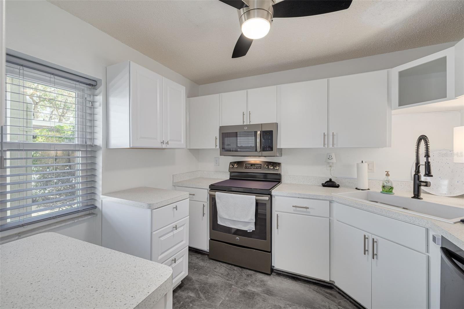 Kitchen with New Cabinets in 2023 and New Farmhouse Sink in 2022.