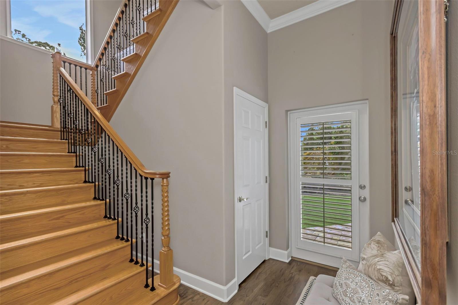 Stairs up to 2 bedroom and 1 bath plus a game room or media room on the landing.